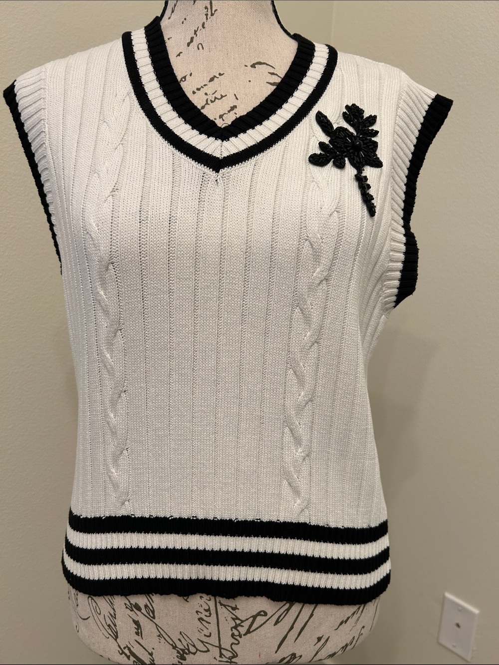 White Knit V-Neck Sweater Vest with Black Trim & Floral Applique